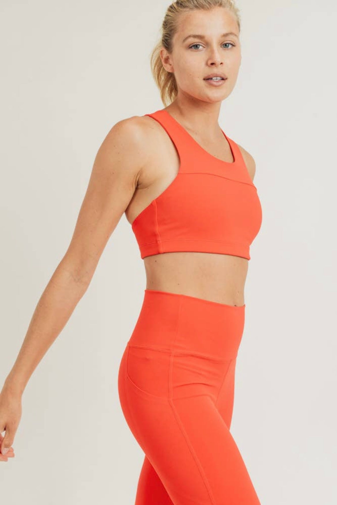 The Poppy Tangerine Adjustable Sports Bra